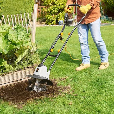 Thematic photo of an electric tiller working in a garden