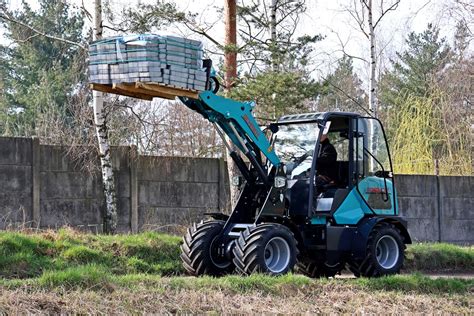 Thematic photo of SCHMIDT mini loader in a farm or construction environment