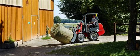 Photo of Weidemann Hoftrac mini loader working in a farm