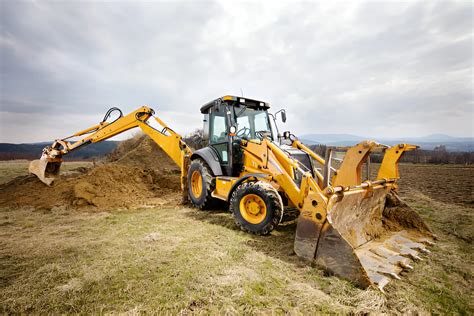 Thematic photo of a backhoe loader working in agriculture