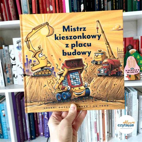 Tematyczne zdjęcie równiarki w akcji na placu budowy