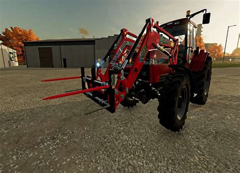 zdjęcie ciągnika z podłączonym ładowaczem czołowym w Farming Simulator