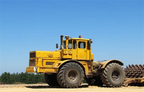 Historical photo of a Kirovets K-700 tractor in a field or during assembly