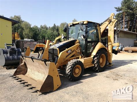 zdjęcie tylnego wysięgu koparko-ładowarki Cat 428E