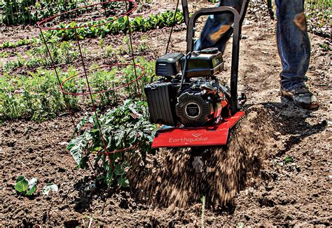 Thematic photo of a small garden tiller in action