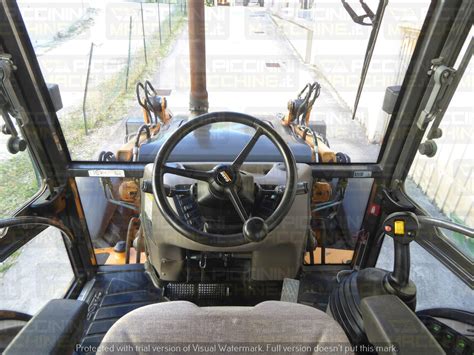 Interior of the Case 580ST cabin, highlighting the ergonomic controls and adjustable seat