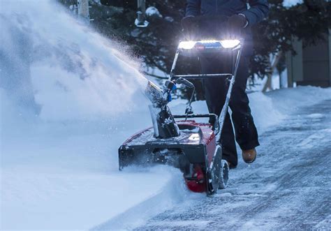 Thematic photo of a Toro Power Max snow blower in action, clearing snow from a driveway