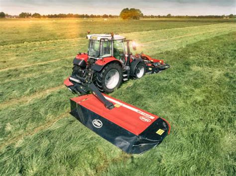 Thematic photo of a Kverneland Vicon Extra 124 disc mower at work in a field