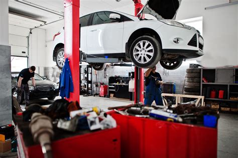 Thematic photo of a mobile workshop crane in a car repair shop