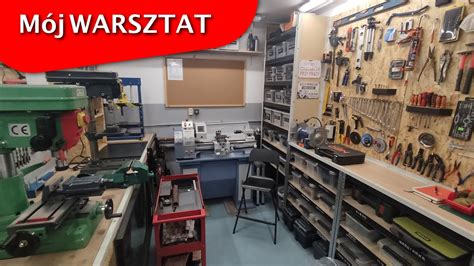 zdjęcie warsztatu serwisowego z pracującymi mechanikami