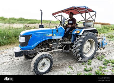Thematic photo of a person operating a garden tractor