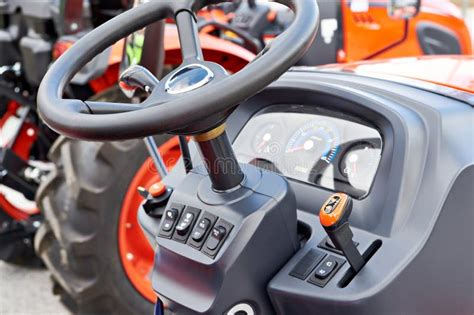 Photo of the control panel and adjustable seat of the tractor