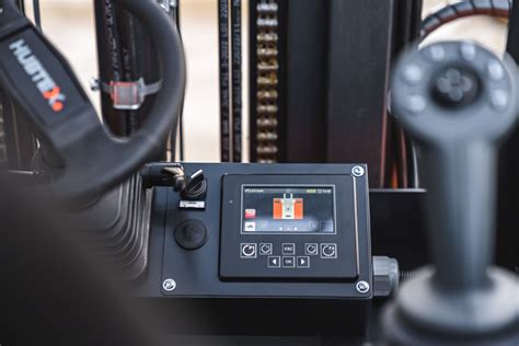 Close-up photo of the HIT3 display in the cabin of a HUBTEX multidirectional forklift