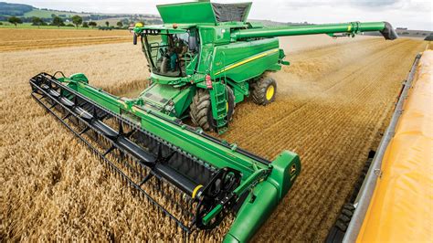 Thematic photo of a John Deere combine harvester at work in a field