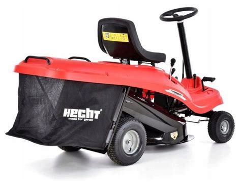 Traktor kosiarka ogrodowa Hecht 5161 SE z boku, na tle ogrodu