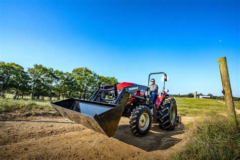 Thematic photo of a compact tractor working in a field