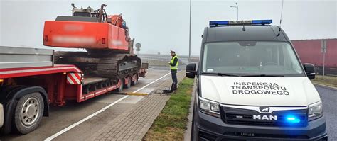 zdjęcie przeciążonej ciężarówki z widocznymi uszkodzeniami kół