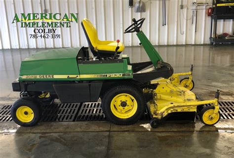 The John Deere F930 front-mount mower operating on a large lawn