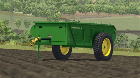 Zrzut ekranu z gry Farming Simulator 22 przedstawiający rozrzutnik John Deere 34