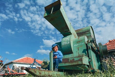 Thematic photo of a child near agricultural machinery, with an emphasis on safety