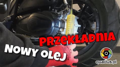 rysunek z informacją o ilości oleju w przekładni kątowej i belce tnącej kosiarek