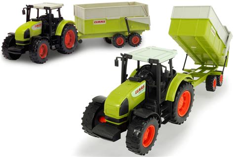 Duży traktor z przyczepą i ruchomą łyżką ładowarki