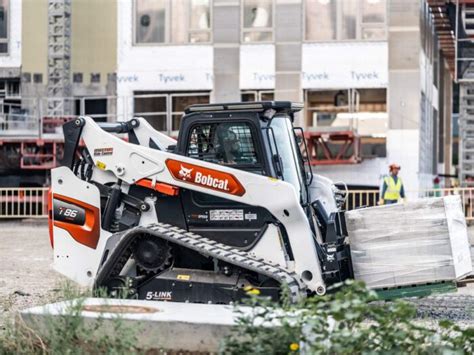 Thematic photo of a Bobcat compact track loader working on a construction site