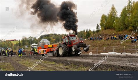 Thematic photo of a tractor with white smoke coming from the exhaust pipe