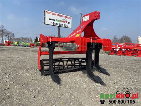 Schematyczny rysunek głębosza Staltech z zaznaczonymi elementami roboczymi i kołami podporowymi.