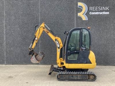 Photo illustrating the tilted cabin for maintenance access on JCB 8020