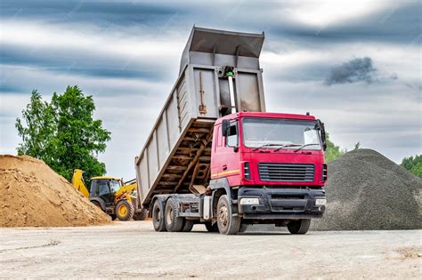 Thematic photo of a dump truck loading building materials.