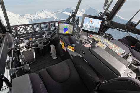 Interior view of the Kassbohrer PistenBully 600 cabin, highlighting the joystick and iTerminal.
