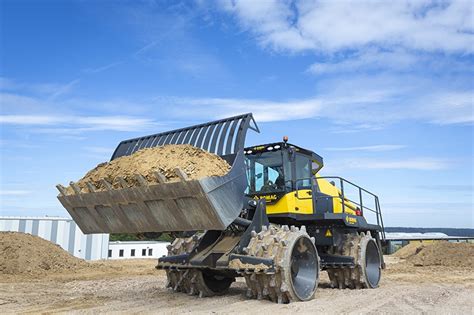 Thematic photo of a BOMAG compactor working on a landfill