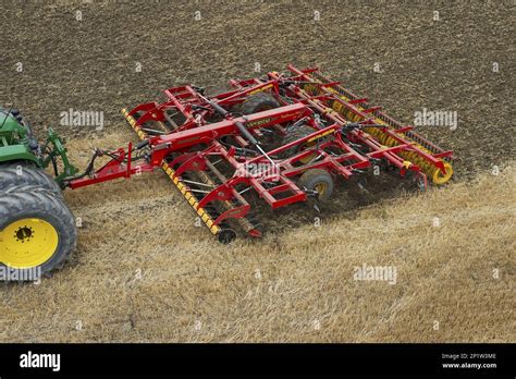 Thematic photo of a stubble cultivator working in the field