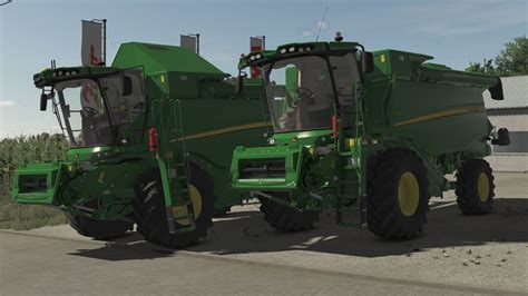 zdjęcie kombajnu John Deere w FS17 z belami cylindrycznymi