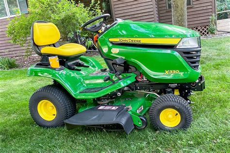 Thematic photo of a lawn tractor in a garden.