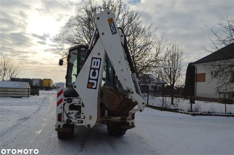 Ilustracja przedstawiająca rozebraną manetkę JCB 3CX z zaznaczonymi mikroprzełącznikami