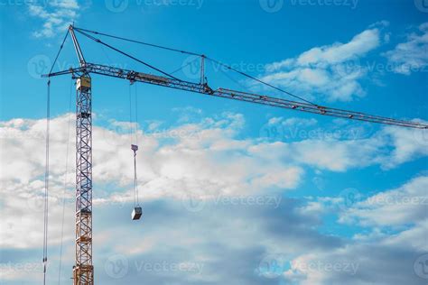 Thematic photo of a construction crane against the sky