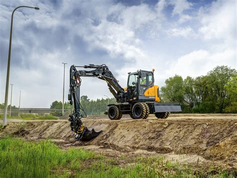Thematic photo of a Vermeer wheeled mini excavator in action