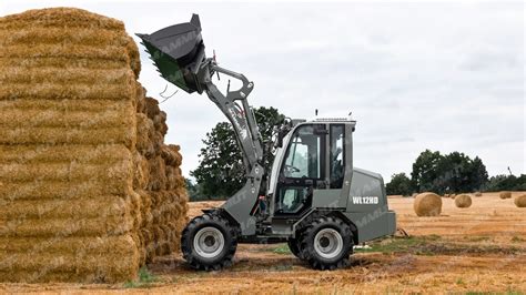 Thematic photo of a farm loader in operation