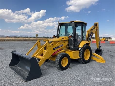 Thematic photo of a Komatsu WB97R backhoe loader from 1996