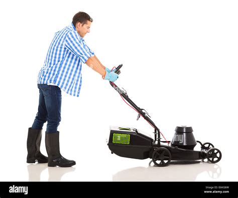 Photo of a person comfortably pushing a lawnmower on a large lawn.