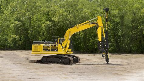 Thematic photo of a vertical drill mounted on an excavator at a construction site