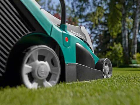 The Rotak 430 LI mower in action on a green lawn, showing its sleek design and cutting precision.
