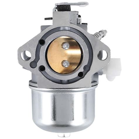 Zbliżenie na gaźnik silnika Briggs & Stratton z zaznaczonym króćcem dolotowym i membraną