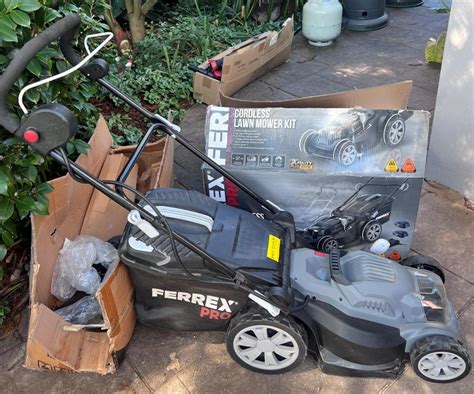 The Ferrex Electric Lawn Mower in action, showing the cable and a compact design