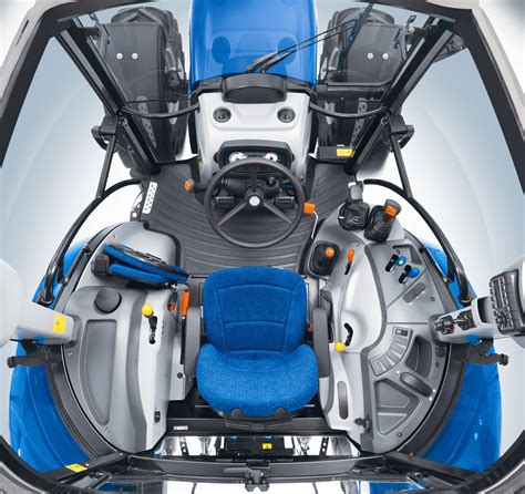 Interior photo of New Holland T4 tractor cabin, highlighting the Command Arc console