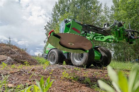 Thematic photo of Avant loader with tree and shrub cutter attachment working in a forest