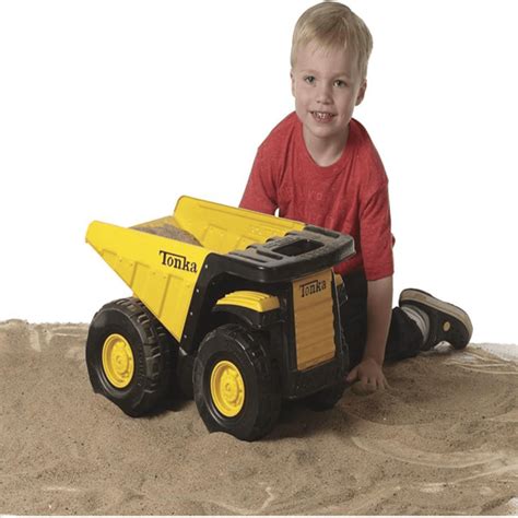 Thematic photo of a child riding a Wader Giant Dump Truck