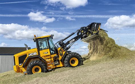 Thematic photo of a JCB loader with forks